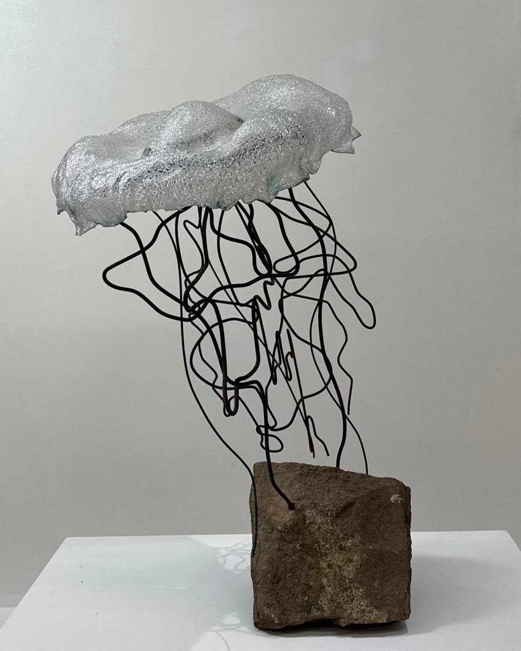 Floating Jelly, Kiln-cast glass, blackened steel wire, salvaged sandstone
